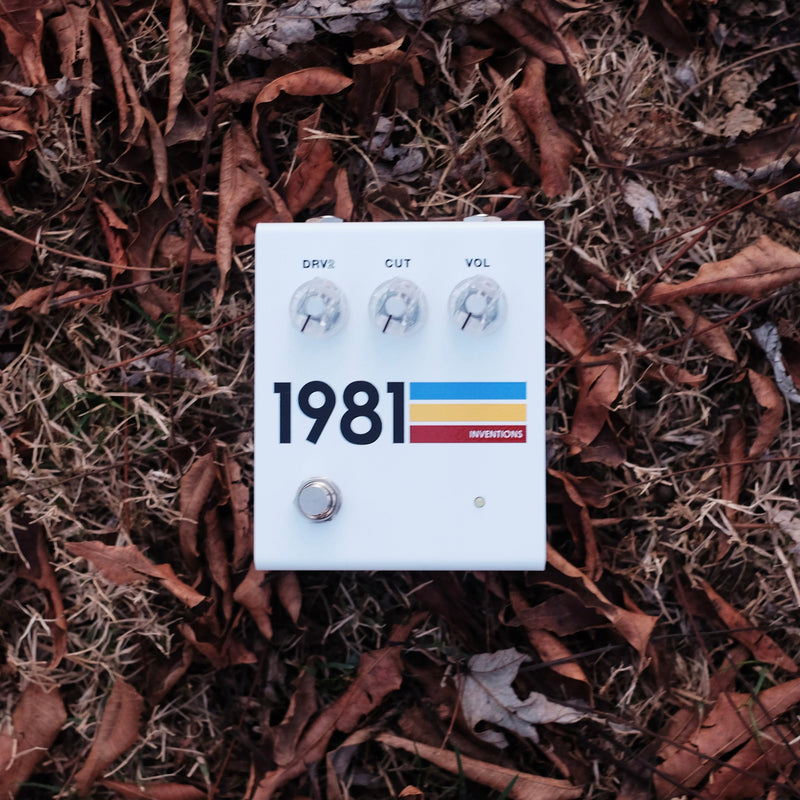 1981 Inventions DRV2 No.3 overdrive distortion guitar pedal shown on autumn leaves